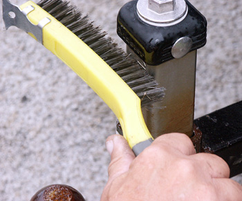 Brushing Surface after USA Fluid is applied which turnes the rust into a burnishing paste that restores the surface to it's original lusture. 