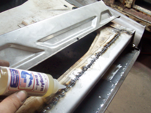 Porsche 356 Restoration Applying StrongArm Over a weld on the door for cleaing and long term protection of the metal surfaces.