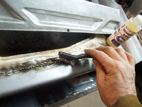 Porsche 356 Restoration cleaning the weld stain with StrongArm Brand Penetrating Oil fluids.
