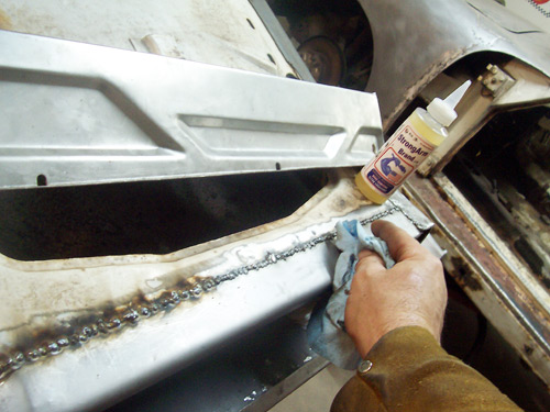 Porsche 356 Restoration Wiping the surface with StrongArm Brand Penetrating Oil Rust Preventative