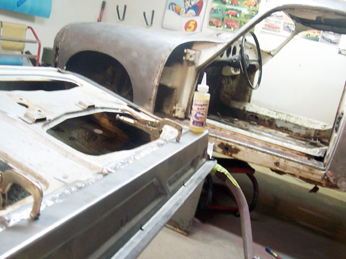 Porsche 356 Restoration with Metal Clamped in place over StrongArm Treated Welds on lower panel